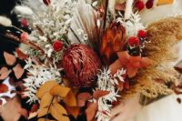 36 a bold fall wedding bouquet of rust and burgundy blooms, bold fall foliage, fronds, bunny tails and grasses is fantastic