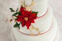 a white wedding cake for a Christmas wedding