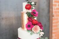 45 a sophisticated wedding cake with a gold foil tier, magenta ribbon, red and magenta blooms and greenery