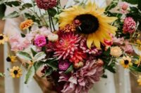 48 a dreamy summer wedding bouquet with pink, blush, orange blooms and sunflowers plus some foliage is a cool idea for a relaxed summer bride