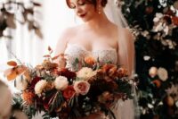 52 a fantastic lush and dimensional wedding bouquet of pink, blush, burgundy, rust blooms, greenery and berries plus bold fall leaves is gorgeous