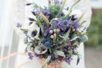 57 wheat, purple lavender, white anemones, blue thistles and various greenery for a colorful statement