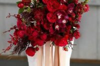 59 a breathtaking jewel tone wedding bouquet with deep red, burgundy and purple blooms, foliage and greenery and long ribbon