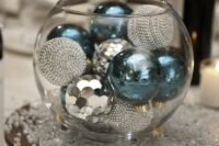 a glass bowl with turquoise and silver ornaments for a New Year wedding is easy to compose