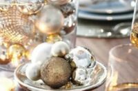 a mercury glass bowl and a glass one with gold and silver Christmas ornaments is a centerpiece that always works