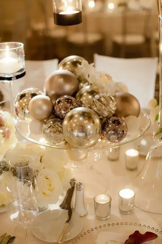 a silver ornaments will be an easy, budget friendly and glam centerpiece is a cool idea for a NYE wedding