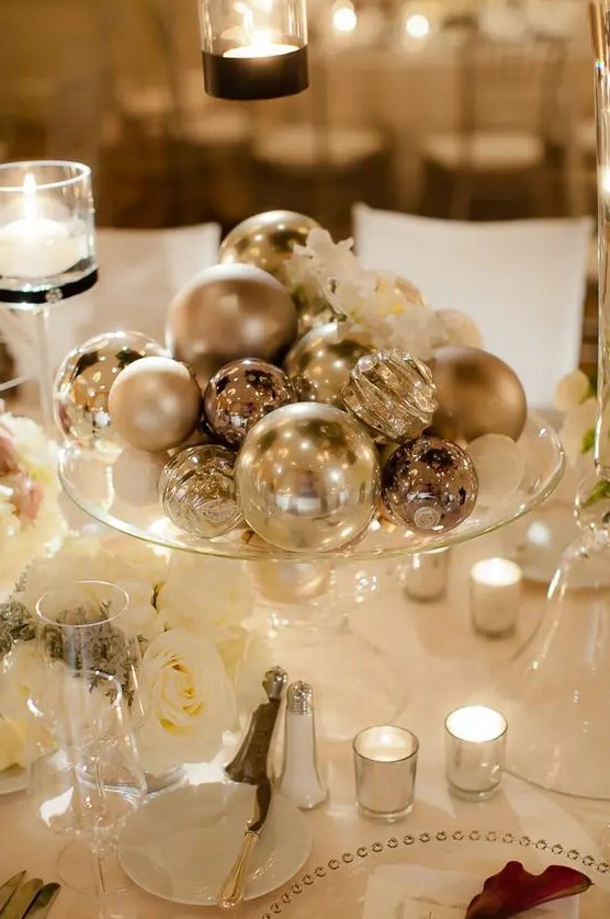 a silver ornaments will be an easy, budget friendly and glam centerpiece is a cool idea for a NYE wedding