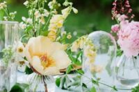 cluster wedding centerpieces of yellow poppies and pink peonies and a greenery runner are amazing for spring weddings