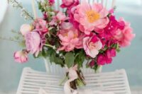 02 a beautiful pink wedding bouquet composed of pink peonies and fuchsia bougainvillea plus greenery