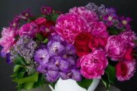 02 a fantastic jewel tone wedding centerpiece of deep red, hot pink and purple blooms and foliage is an amazing idea for the fall