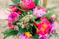 04 a bold and dimensional wedding bouquet of hot pink and yellow blooms, lots of greenery and leaves is an amazing idea