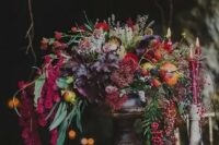 06 a luxurious wedding centerpiece with cascading blooms and foliage, colored fall leaves and berries