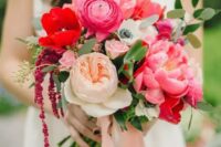 08 a bold wedding bouquet of pink peonies and ranunculus, neutral peony roses and red anemones and some greenery