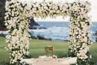 09 a floral arbor covered with white roses completely and a backdrop of the ocean look wow