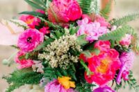 10 a bright tropical wedding bouquet with hot pink blooms, ferns and greenery, some blush tropical blooms and berries is amazing