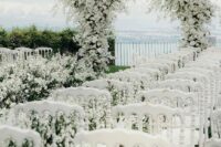 10 a gorgeous all-white wedding arch covered with a lot of blooms and a matching wedding aisle will make your ceremony unforgettable