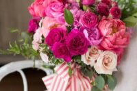 11 a bright wedding bouquet of pink, hot pink and fuchsia blooms, greenery and striped ribbons is a fantastic solution