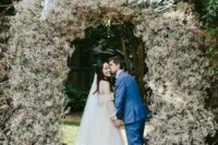 13 a jaw-dropping wedding entrance or arch covered with white and blush baby’s breath completely looks fantastic