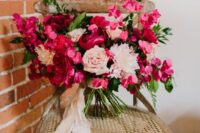 14 a lush fuchsia and blush wedding bouquet with plenty of dimension, greenery and blush ribbon is wow