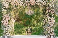 16 a lush wedding arbor decorated with greenery, neutral and blush blooms and some cascading touches is a lovely idea for a wedding