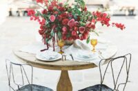 16 a super lush and bold wedding centerpiece of pink, deep red and burgundy blooms and greenery is a gorgeous idea for a Valentine wedding