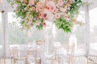 17 a beautiful and sophisticated tall floral wedding centerpiece with white, blush and peachy blooms and greenery is a lovely idea for spring or summer