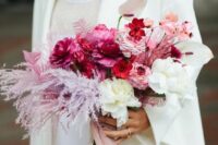 19 a jaw-dropping pink wedding bouquet of fuchsia, red and blush and white blooms and light pink dried leaves, blush ribbon