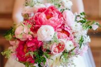 21 a pink wedding bouquet with light and hot pink blooms and greenery is an amazing touch of color