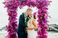 26 a fantastic hot pink and fuchsia wedding arch totally covered with blooms is a bright and statement-like idea for a wedding