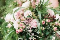 26 a gorgeous secret garden wedding centerpiece with lots of greenery and grasses, lots of pink blooms and berries is amazing for summer