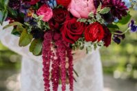 27 a bold wedding bouquet with pink, red, burgundy, purple and blue blooms, foliage and amaranthus is amazing for the fall
