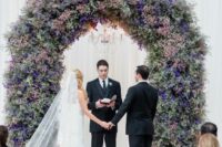 28 a chic and lush wedding arch decorated with pale pink, pink and purple blooms is a gorgeous statement for a ceremony