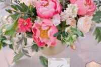 33 a beautiful wedding centerpiece of blush, white and bold pink blooms and greenery is great for spring and summer weddings