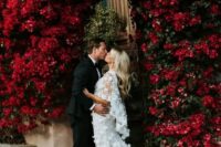 34 a jaw-dropping wedding arch of living deep red blooms growing here is a fantastic solution for a refined and lush fall wedding
