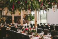 34 a lush greenery and floral overhead wedding decoration creates a strong wow effect