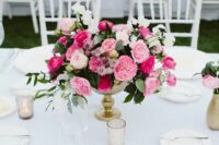 38 a bright pink and blush wedding centerpiece with foliage and white blooms is a cool idea with a touch of color