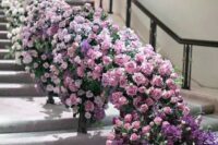 40 an ombre floral staircase from white to lavender and light pink and then to purple is a bold and catchy decor idea