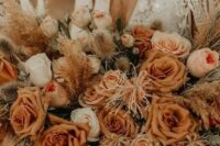 41 a warm-colored rust wedding bouquet with white blooms, dried touches and greenery for a desert boho bride
