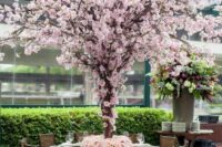 41 an oversized blooming tree wedding centerpiece of pink cherry blossom trees is a fantastic idea to give your reception a garden feel