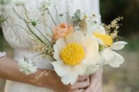43 a delicate and chic wedding bouquet composed of Claire de Lune peonies, coral peonies, and white daisies