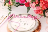 45 a pretty glam wedding tablescape with light and hot pink blooms, wodoen placemats and pink calligraphy cards, with gold cutlery