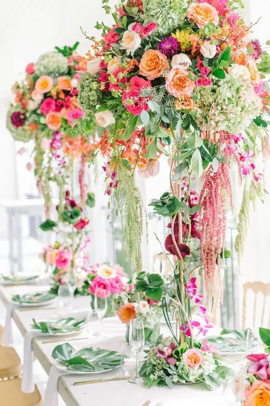 jaw-dropping secret garden wedding centerpieces of greenery and lots of colorful blooms, from bottom to the top are fantastic