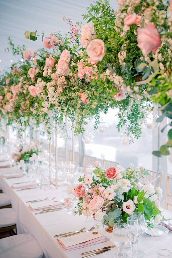 refined wedding table decor with tall and large blush wedding centerpieces that are doubles in the on-table floral arrangements