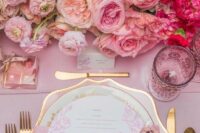 48 a super lush pink wedding centerpiece of blush, pink and hot pink blooms with an ombre effect is a beautiful solution