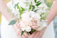 48 a tiny wedding bouquet with white and blush blooms, greenery and waxflower is great for spring and summer