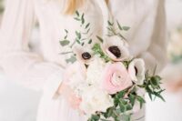 49 a small wedding bouquet with white anemones and white and pink ranunculus and greenery for a spring or summer bride