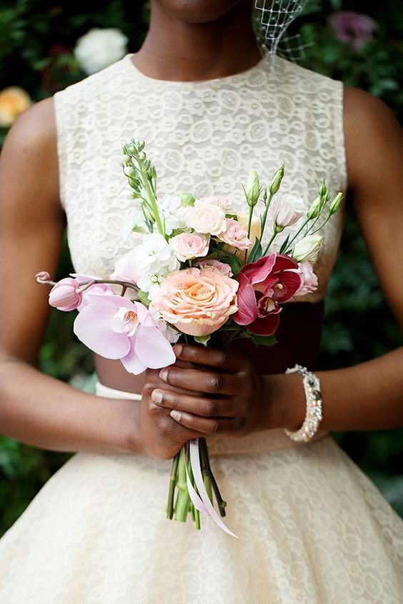 a small and chic wedding bouquet with white, peachy, pink and burgundy blooms is an elegant idea