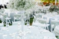 63 a tall baby’s breath wedding centerpiece in a sheer tall vase is a timeless solution that will fir many formal weddings