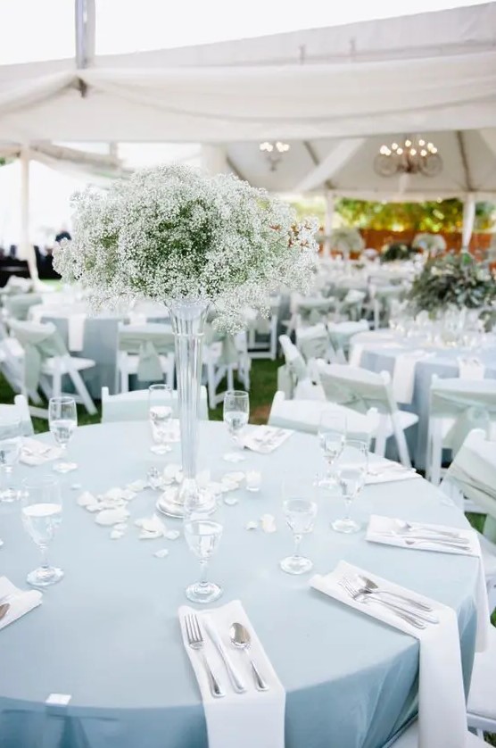 a tall baby's breath wedding centerpiece in a sheer tall vase is a timeless solution that will fir many formal weddings