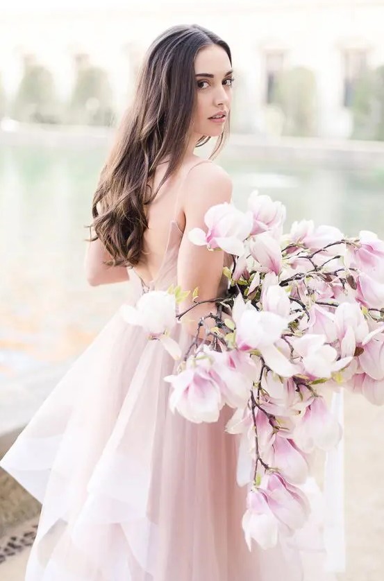 a super romantic and chic pink one flower wedding bouquet is a gorgeous solution for a spring bride